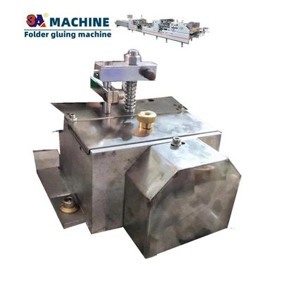 Machines à coller automatiquement des boîtes de carton
